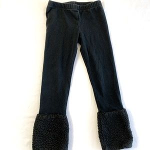 Girls size 4T black leggings with “fur” muff at the end of each leg winter
